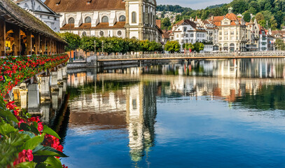 Fototapeta na wymiar Chapel Wooden Covered Bridge Jesuit Church Reflection Lucerne Switzerland