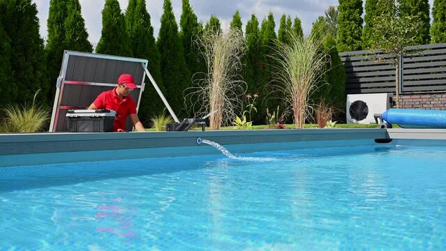 Swimming Pools Technician in His 40s Performing Seasonal Pool Equipment Maintenance
