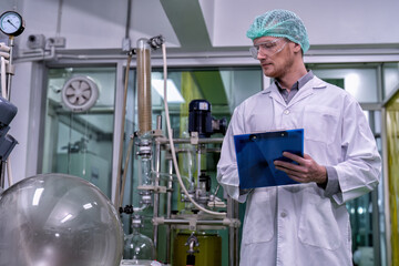 maintenance engineer scientist routine check the distillation glass siphon tube