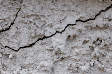 old stone wall with cracks