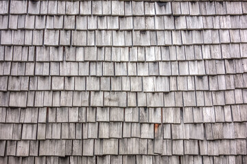 Texture of wooden tile roof. Shake shingles