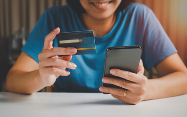  Woman paying and shopping with smartphone application concept. Digital money transfer, banking and e commerce concept.Mobile payment with wallet app technology. online shopping at home concept.