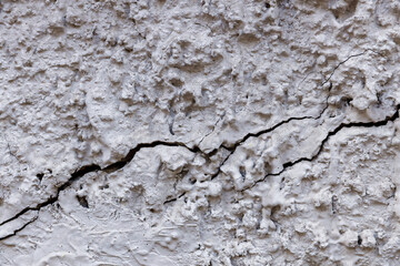 old stone wall with cracks