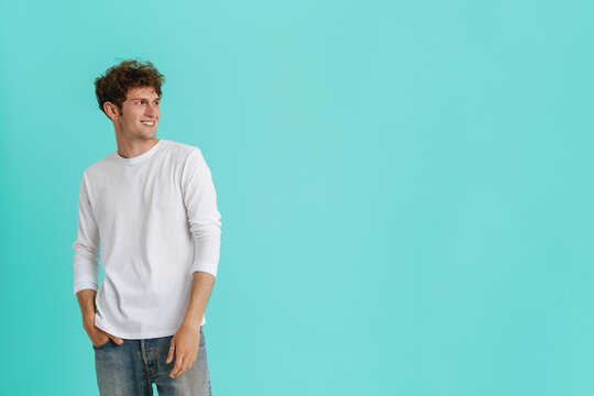 Young Handsome Curly Smiling Man In White Longsleeve