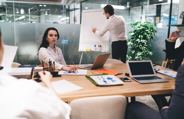 Coworkers during presentation in boardroom