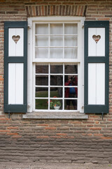 Fototapeta na wymiar old wooden window with shutters