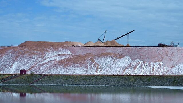 Conveyor line in working process at the mining and processing plant for the extraction of potash mineral salt
