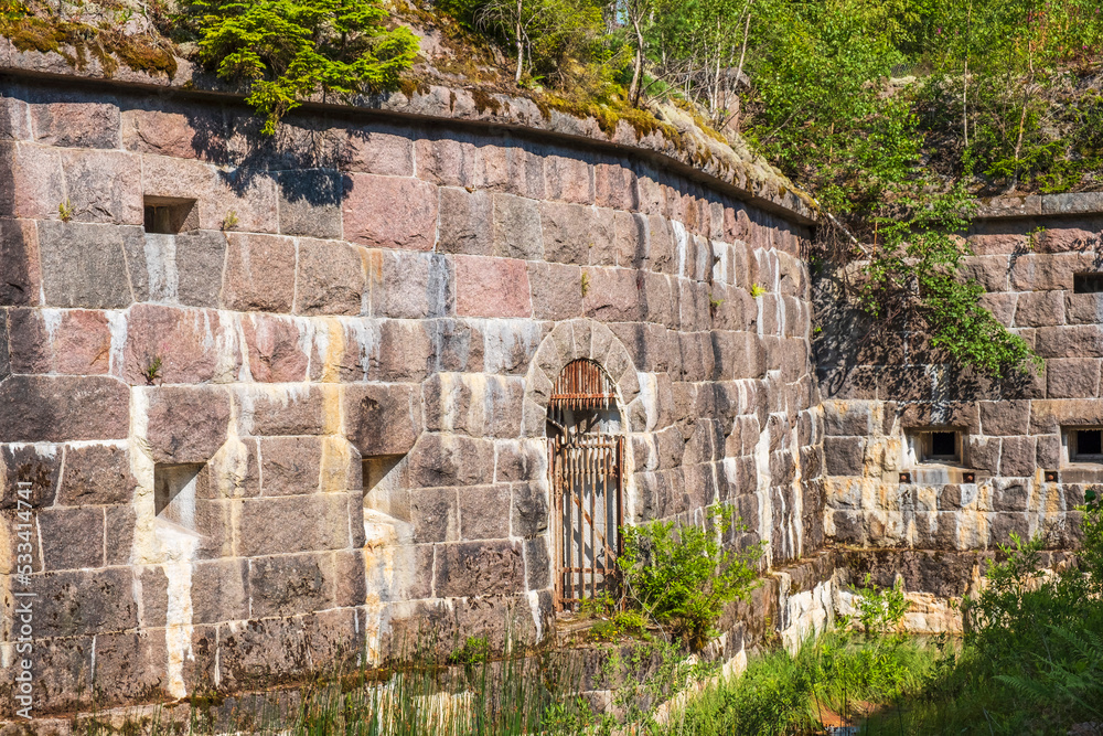 Poster Old fortress with a fortified wall in the moat