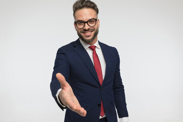 excited businessman offering one's hand and closing the deal