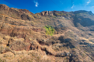 Mountains of Madeira Island against blue sky on the background, Portugal