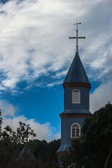 wood church with blue sky