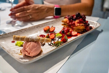 Tasteful strawberry ice cream ball plate at the restaurant