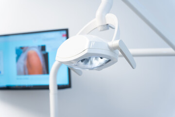 Lamp to illuminate operations. Protected room of the dental clinic for x-rays
