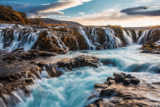 Fantastic Bruarfoss Waterfall. Amazing nature of Iceland. Iceland popular place of travel and touristic location. Wonderful Icelandik landscape during sunset. Creative image. Natural background