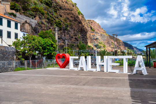 Calheta tourist sign with hearth and letters forming Calheta at entrance to Calheta waterfront, Madeira - Portugal