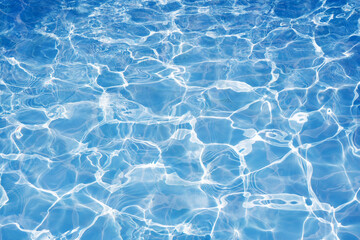 Fototapeta na wymiar Water in swimming pool background, Blue water surface with bright sun light reflections