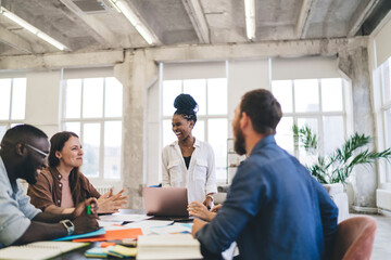 Group of multiethnic coworkers having meeting in office