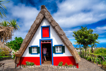 Fototapeta na wymiar Madeira island rural traditional house village landscape, Portugal. City of Santana on a beautiful sunny day