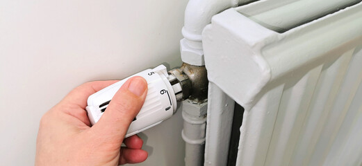 Regulating radiator in the home to use less district heating or turn off the heat 