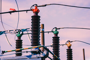 High voltage electric transformer.Electric current redistribution substation against the blue...