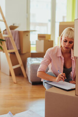 Woman moving in sign contract.