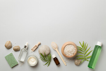 Composition with spa products on color background, top view