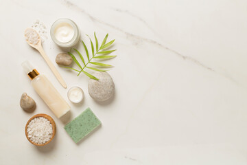 Composition with spa products on marble background, top view