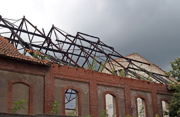 A burnt roof on a German-built building. Chernyakhovsk, Kaliningrad region