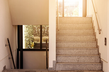 Stairs Inside the Building, Internal Staircase with Stainless steel Handrail and Sunlight.