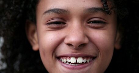 Child real life laugh and smile. Little African girl reacting laughing and smiling