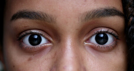 Obraz premium Black teen girl staring at camera, child closing eyes