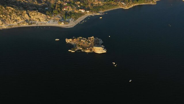 Aerial footage of a lake and islands, top view of bafa lake with sunset light and day time light