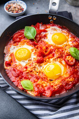 shakshuka eggs, tomato, pepper, vegetables breakfast healthy meal food snack diet on the table copy space food background rustic top view