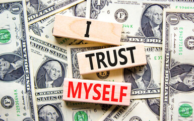 I trust myself symbol. Concept words I trust myself on wooden blocks. Dollar bills. Beautiful...