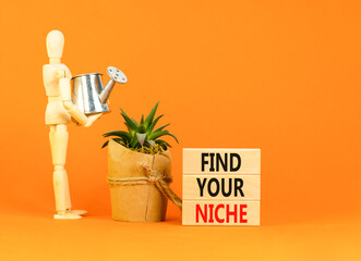 Find your niche symbol. Concept words Find your niche on wooden blocks. Businessman model. Beautiful orange table orange background. Business and find your niche concept. Copy space.