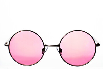 Round sunglasses with pink glasses with a gradient in a metal frame on a white background. Sun glare on the glass.