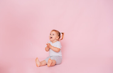 Wow. Studio shot of an emotional charming little girl, surprised and shocked, showing a truly amazed reaction to unexpected news