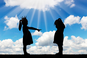 School bullying. Girl points finger at another crying girl.