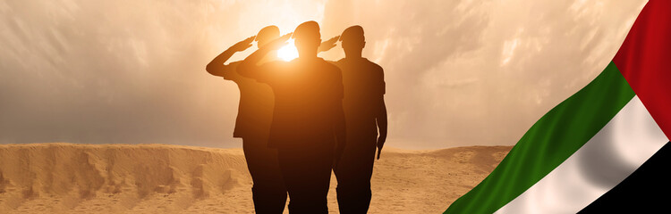 Silhouette Of A Solider Saluting Against the flag of UAE. Concept of national muslim holidays. Independence Day, Victory Day.