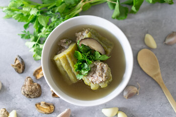 Stuffed bitter gourd with seasoned minced pork soup Thai foods on white bowl
