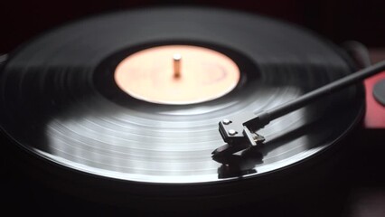 Launching a vintage vinyl player. close-up. black vinyl record. panorama.
