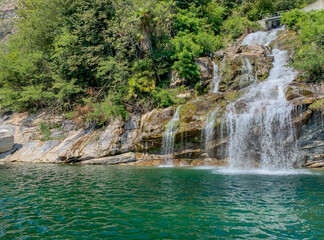 Fototapeta na wymiar waterfall with green river in summer