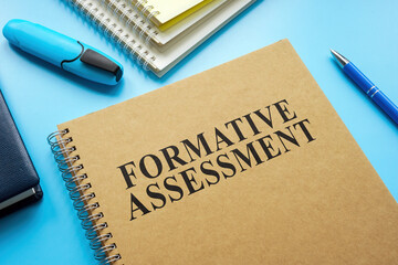 Formative Assessment guide and notebooks on the desk.