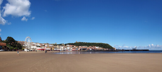 Long panoramic view of town of Scarborough from the beach on the south bay