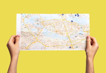 Paper map in hands, POV. Tourism and holiday sightseeing. High quality photo