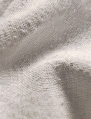 Close up of textured old white fabric