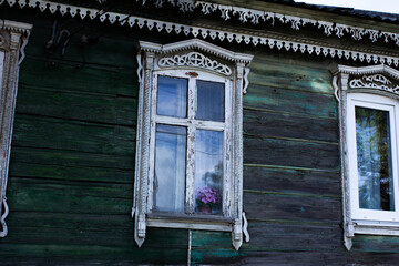 Beautiful vintage windows with decorative elements, wooden windows with carved architraves,...