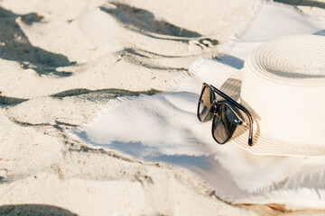 Straw beach hat with brim for sun protection with glasses.