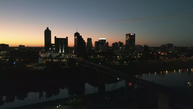 Drone Shot of a Sunrise by the Mississippi River Bridge in Downtown Memphis Tennessee