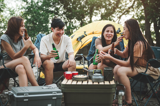 Group Of Friends At Campground, Camping Tent With Friends, Diverse Asian Young Family Hangout Together At Camp Yard. Outdoor Activity And Leisure On Holiday.